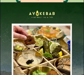 Avocado hummus, guacamole, falafel and dolma mix plate